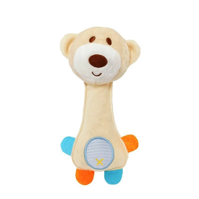 A light tan plush dog toy shaped like a puppy with a brown nose and blue feet.