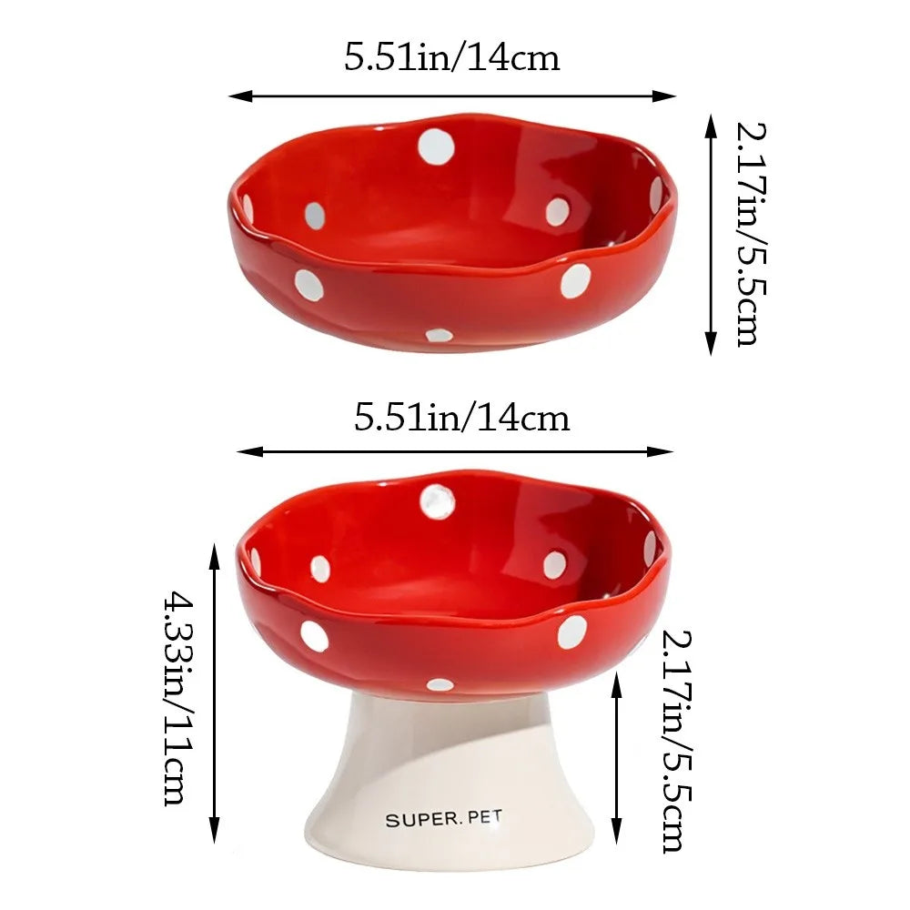 A red ceramic pet bowl with white polka dots and a matching pedestal base.