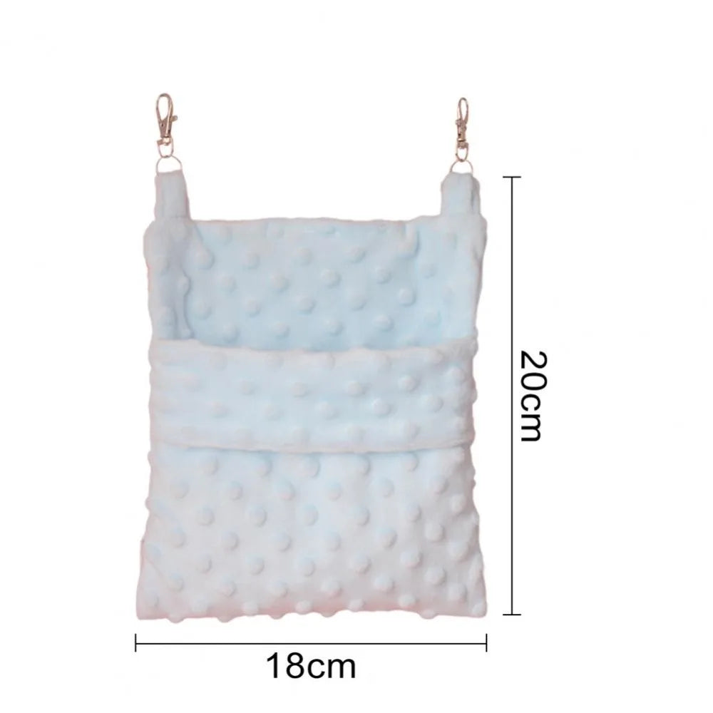 A light blue and white cozy hanging sleeping bag for small pets with metal loops.
