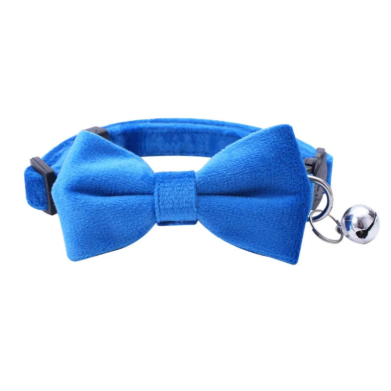 Blue adjustable breakaway cat collar featuring a bow tie and silver bell.