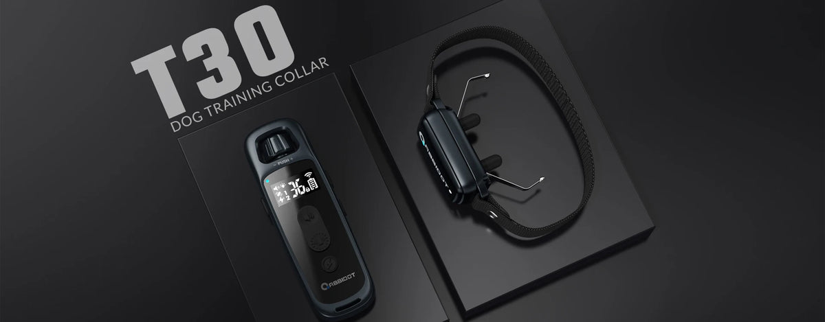 A black T30 dog training collar and replacement strap are displayed on a dark surface.