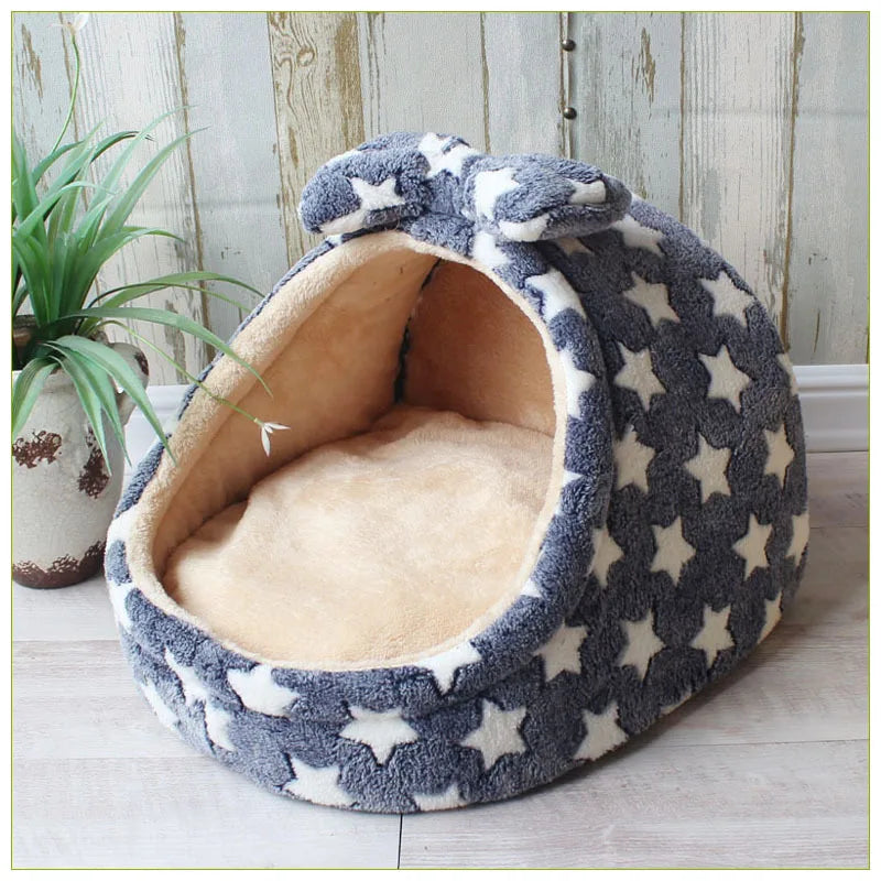 A gray and white patterned pet bed shaped like a cave for small and medium dogs