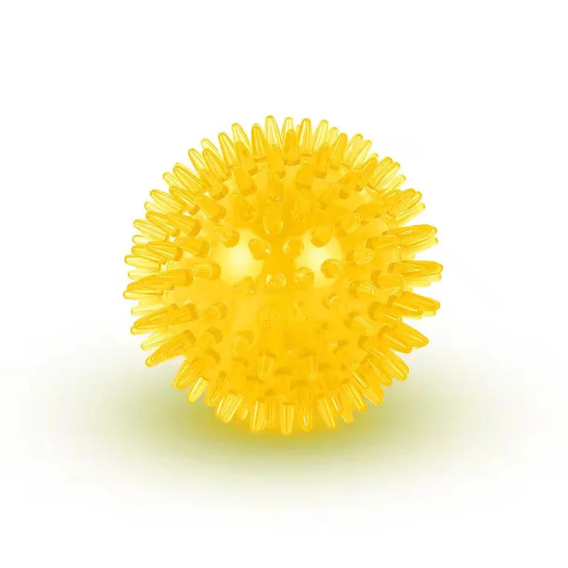 A bright yellow, spiky ball-shaped dog toy for interactive play and dental health.