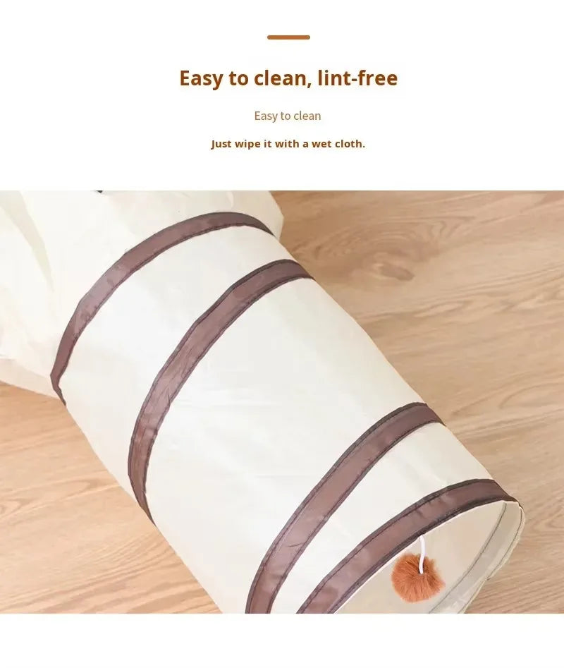 A roll of white fabric with brown stripes, used as a foldable pet play tunnel for cats and small animals.