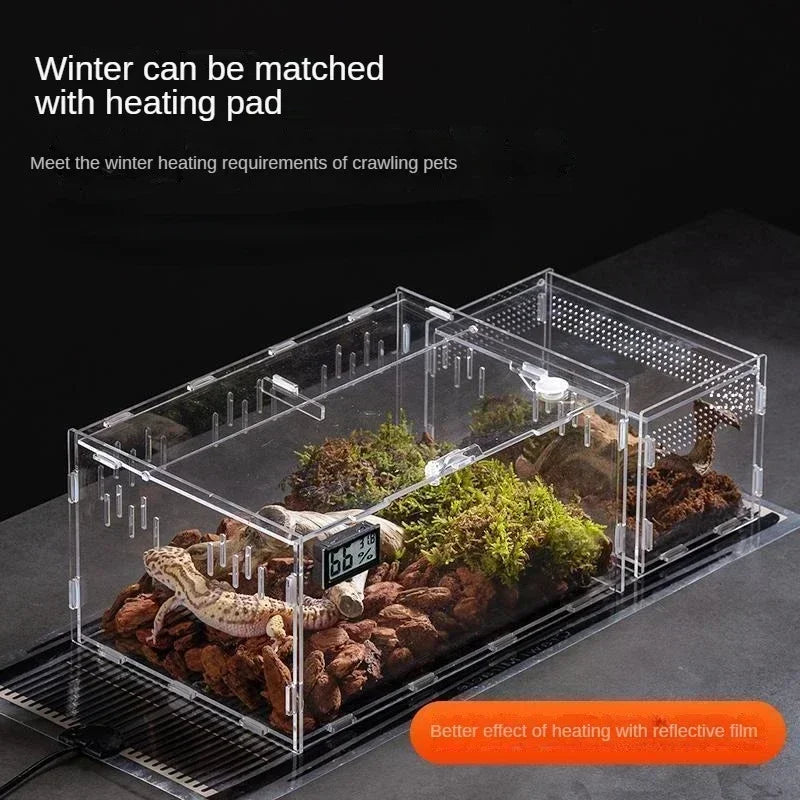 A transparent acrylic reptile terrarium with a heating pad and reflective film for crawling pets.