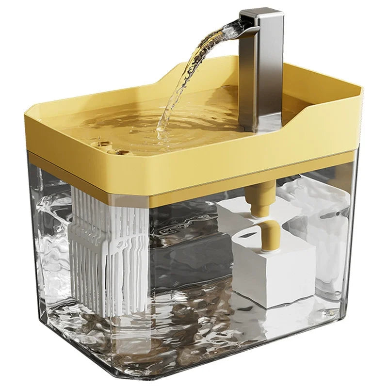 A yellow automatic cat water fountain with a stainless steel spout is shown inside a clear container.