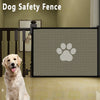A black dog safety fence mesh gate with a paw print design installed between wooden railings.