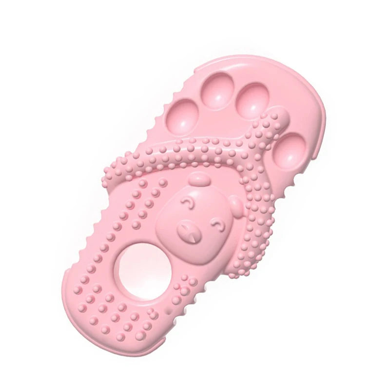 Pink rubber chew toy for small dogs featuring a dental cleaning texture and various holes.