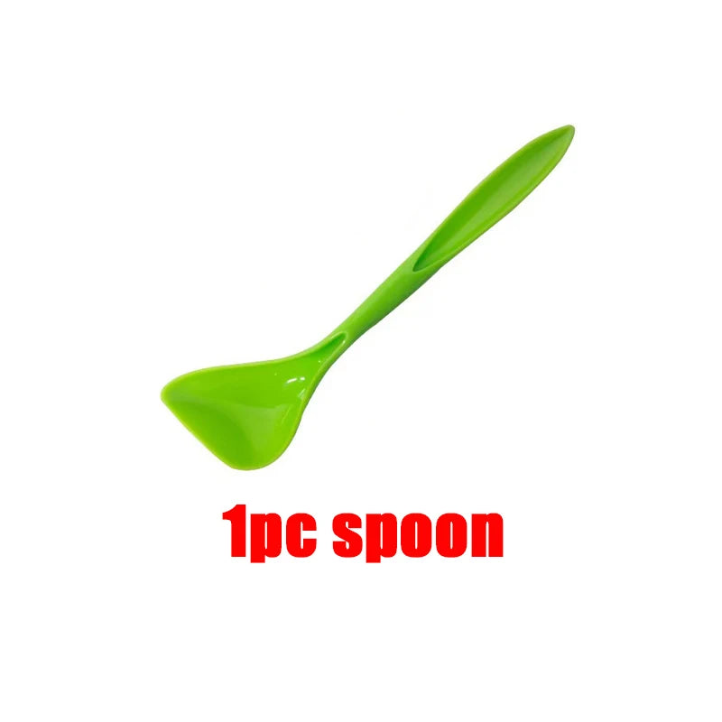 A bright green reusable silicone spoon for pet food.