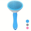 A light blue pet hair removal slicker brush with a white handle and silicone bristles.