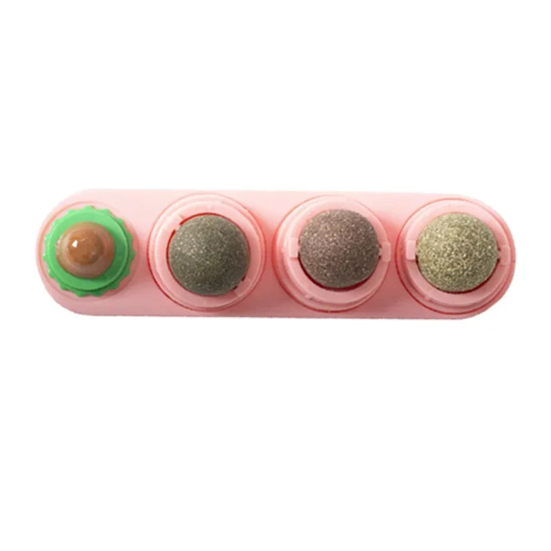 Pink rotating catnip ball toy with three textured balls for dental health and digestion