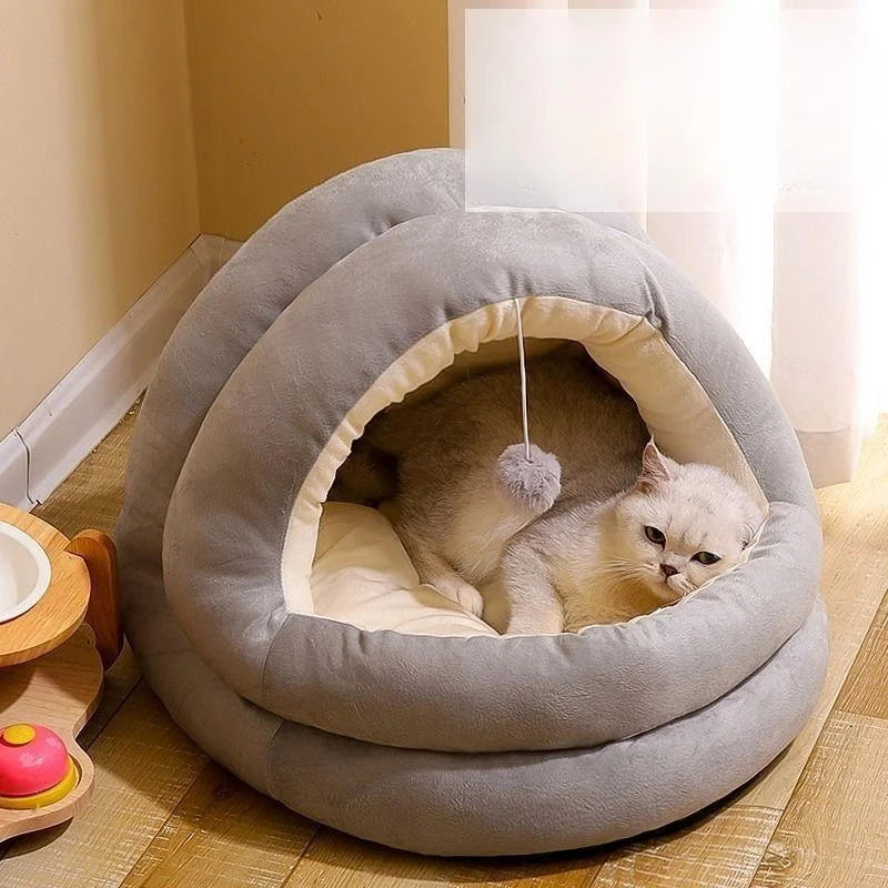 A fluffy light gray cat nest bed with a hood, featuring a cozy interior for a pet.