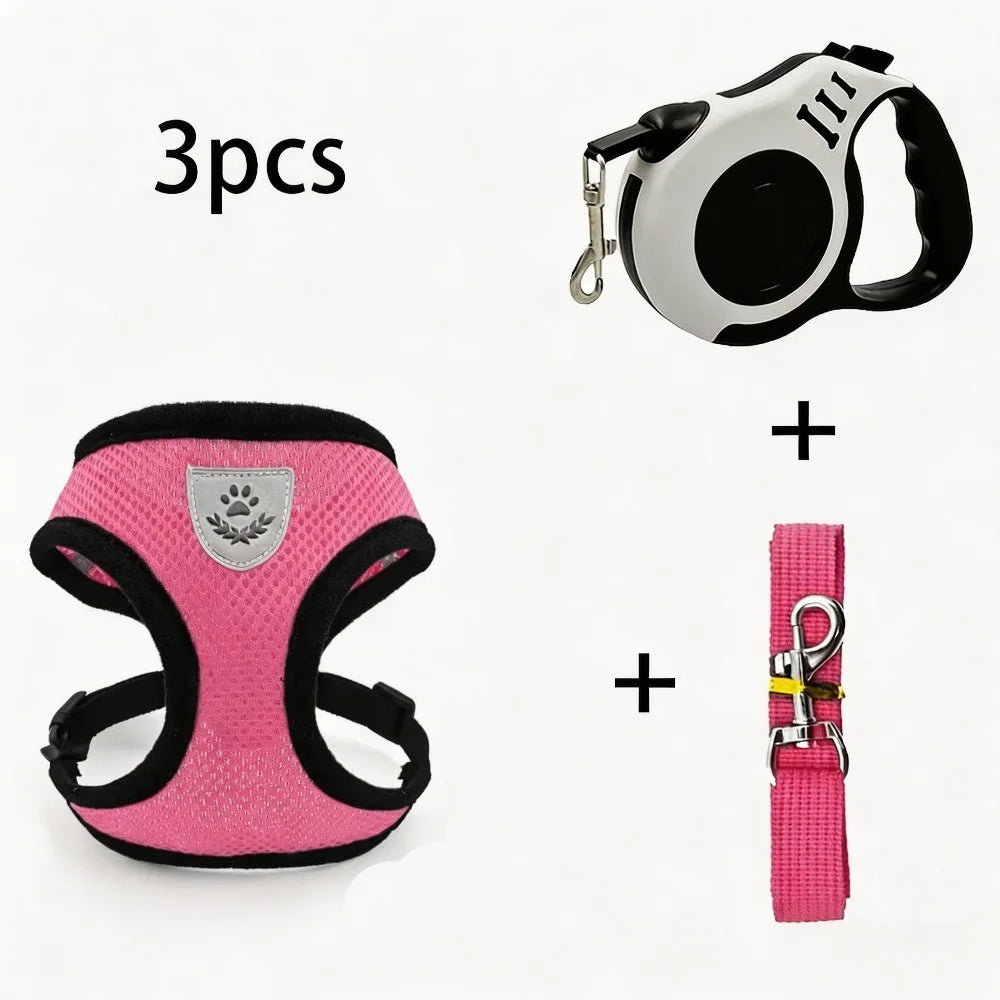 A set of three pieces including a black harness, a pink harness, and a pink retractable leash for a cat.