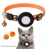 Orange nylon cat collar with a black circular holder and a reflective strip on a gray cat's neck.
