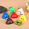 A collection of colorful silicone dog waste bag dispensers shaped like smiling animals, including green, blue, red, white, an
