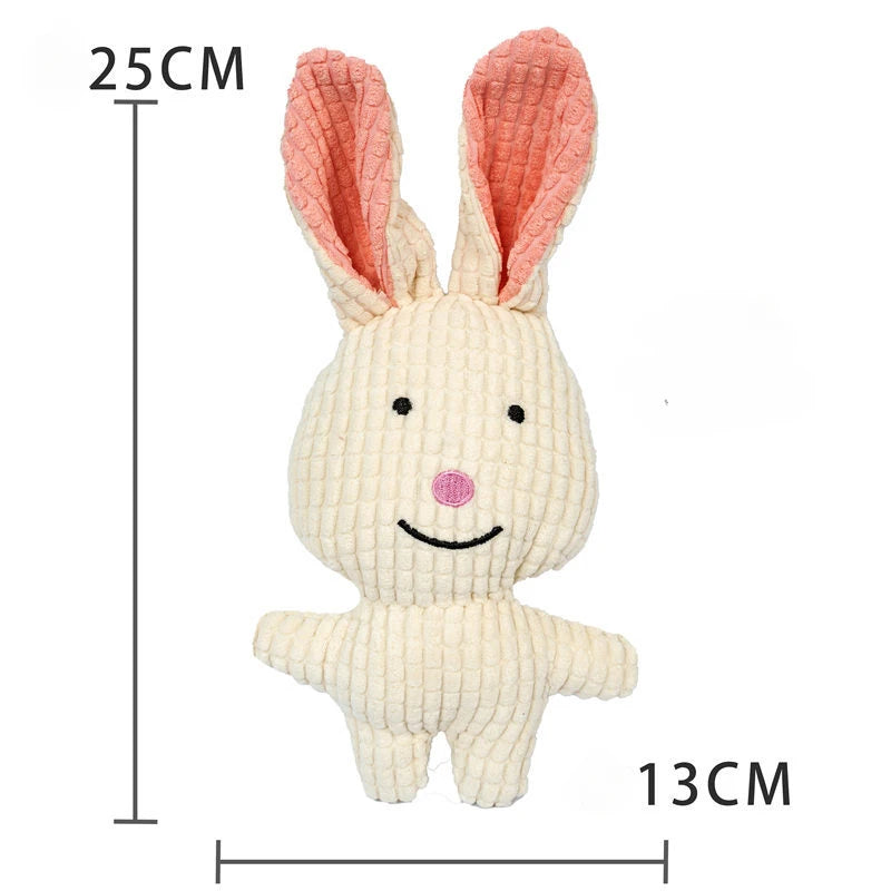 A light beige plush toy shaped like a rabbit with pink ears and a smiling face.