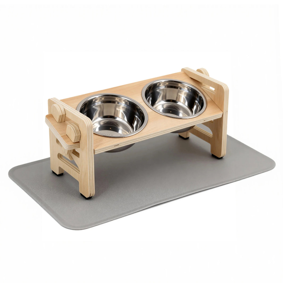 A wooden elevated stand holding two stainless steel puppy bowls on a gray food mat.