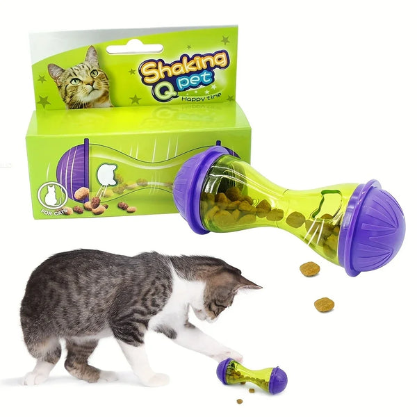 A cat is interacting with a purple and lime green interactive pet feeder ball toy.