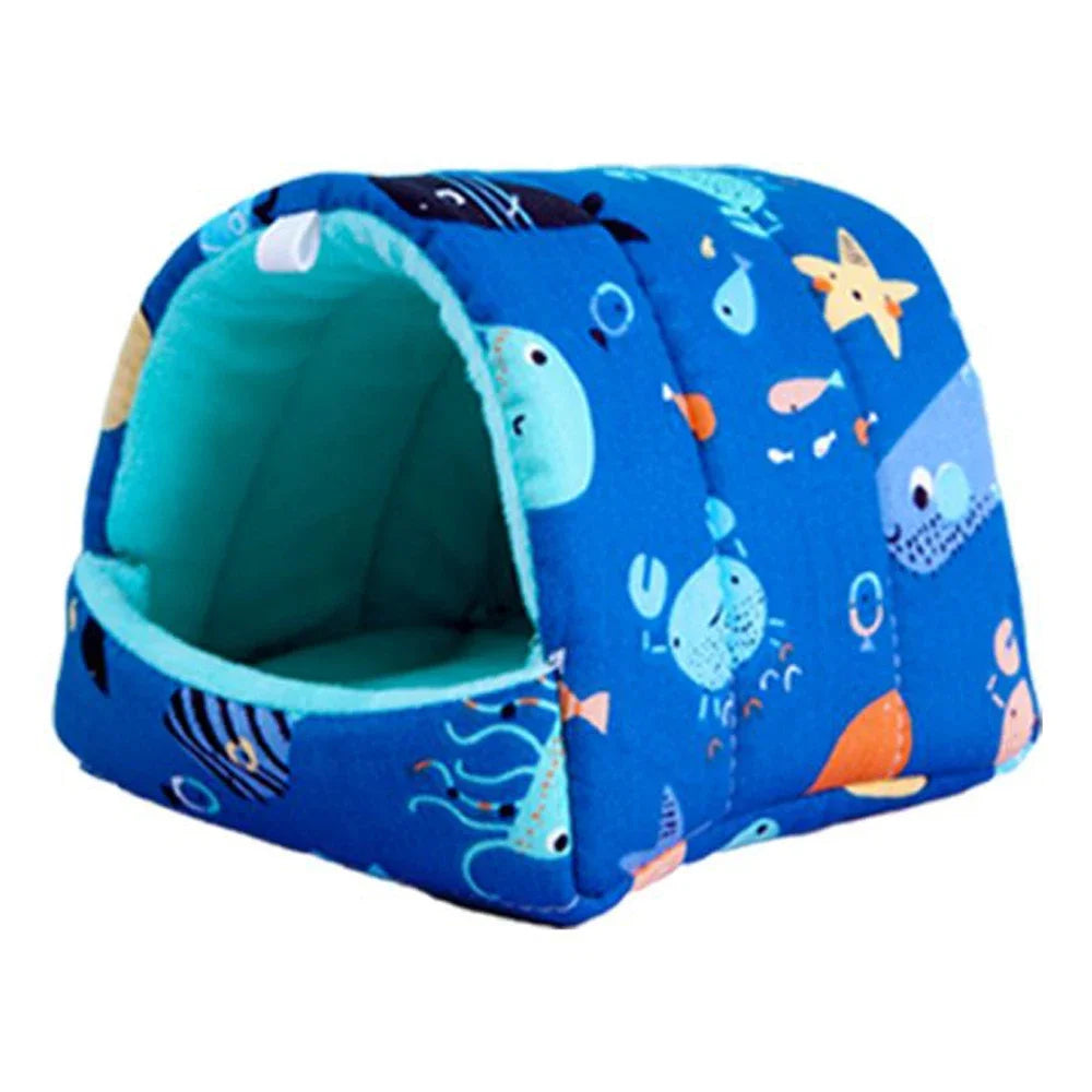 A blue flannel pet nest bed decorated with various sea creatures and patterns.