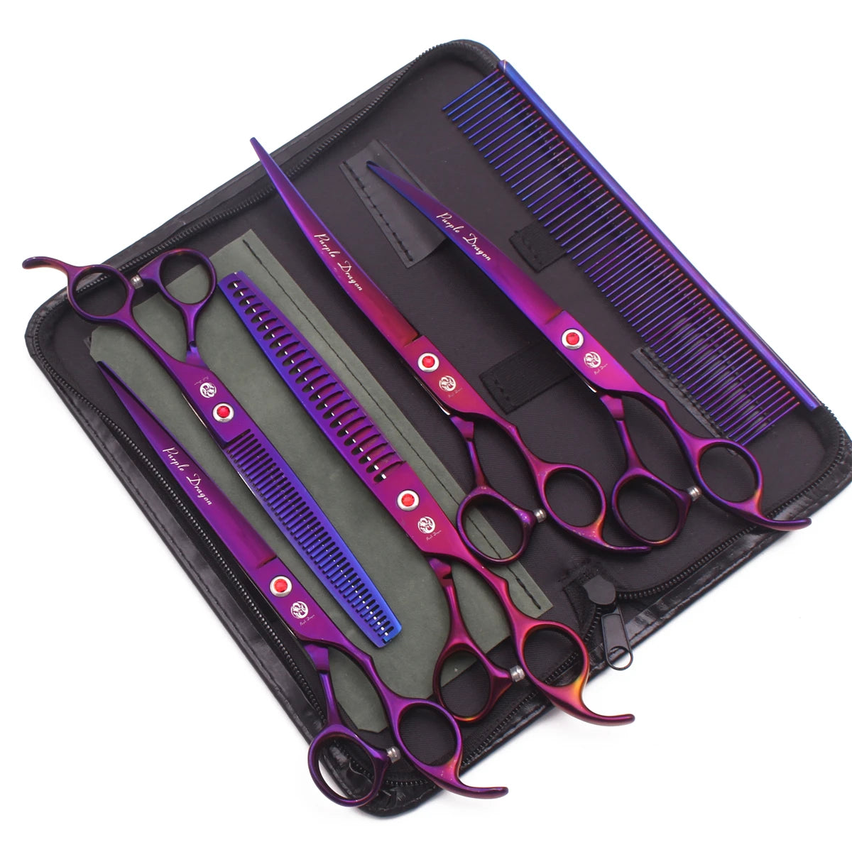 A set of professional stainless steel pet grooming scissors with purple and silver handles and blades, laid out in a black ca