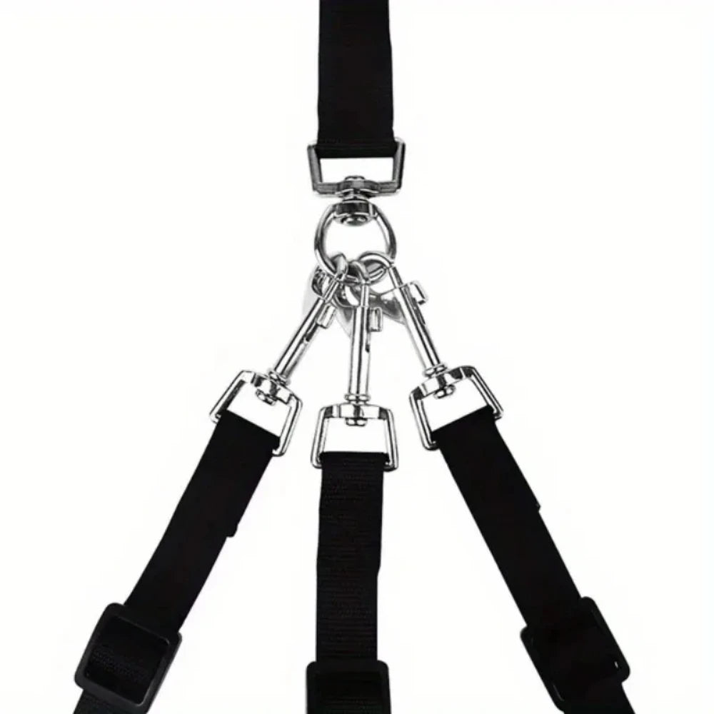 A black 3-in-1 nylon dog leash with a padded handle and three straps for walking and travel.