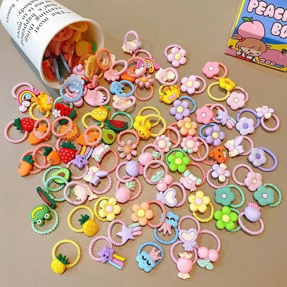 A collection of cute cartoon elastic hair ties and accessories in various colors and shapes.