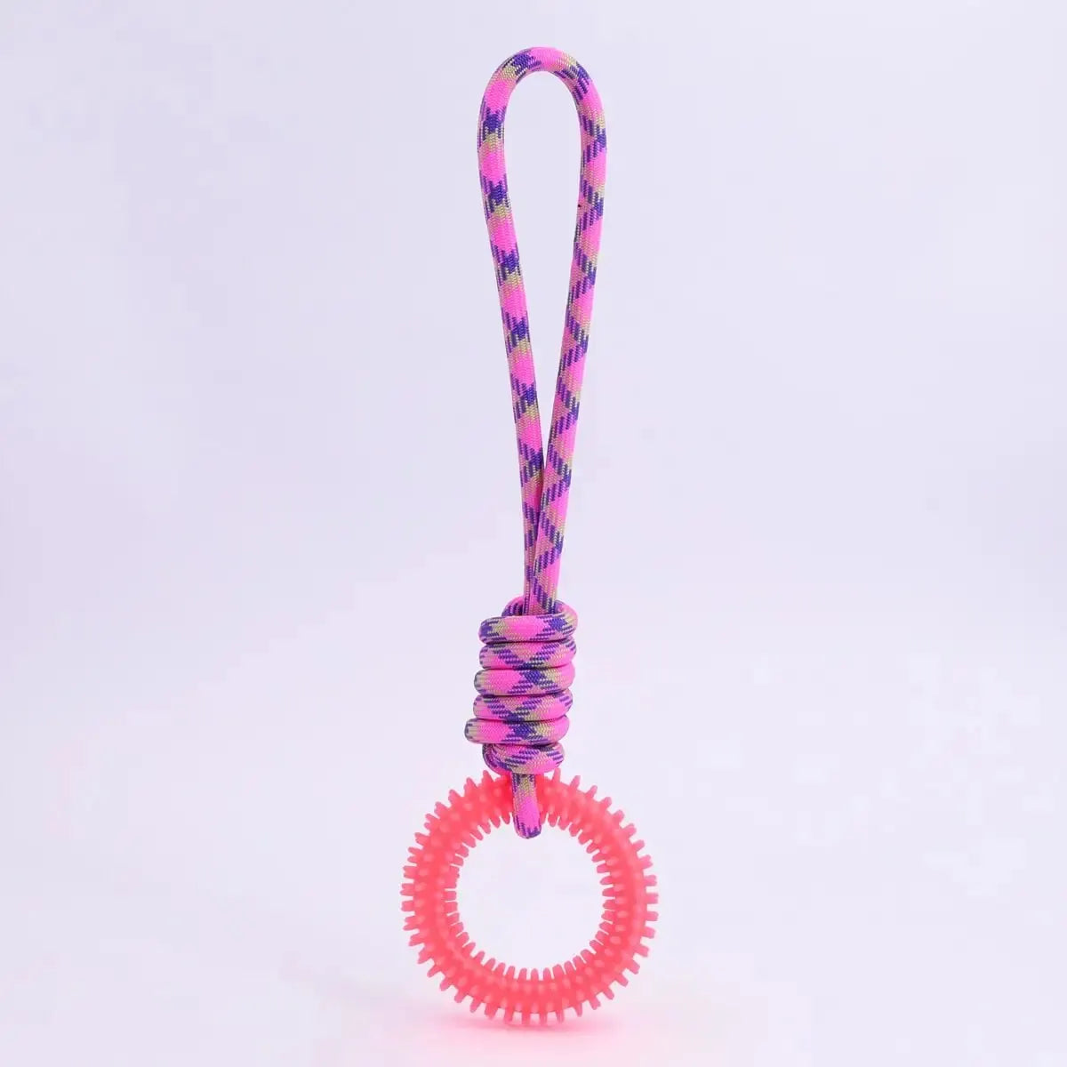 A pink and yellow braided dental chew ring for dogs with a circular, textured tip.