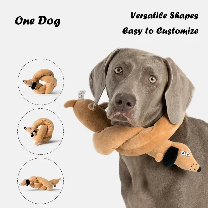 A gray dog is holding a tan plush toy shaped like a coiled snake for a versatile dog toy.