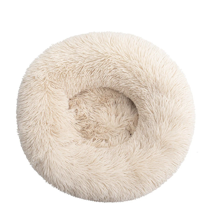 Round beige plush pet bed for dogs and cats with soft, fluffy texture
