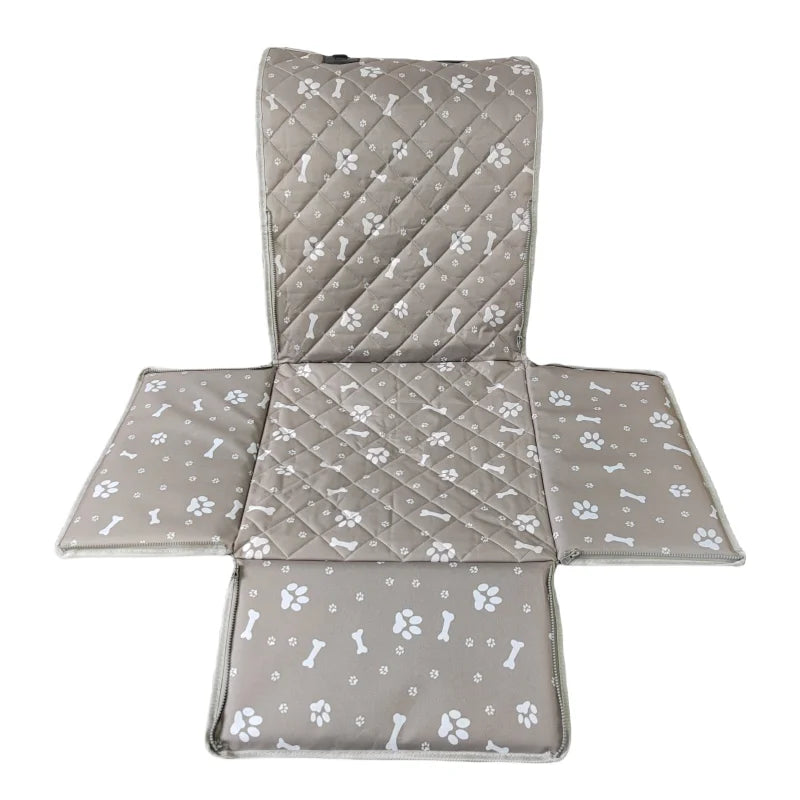 A quilted gray waterproof dog car seat hammock with paw print patterns.