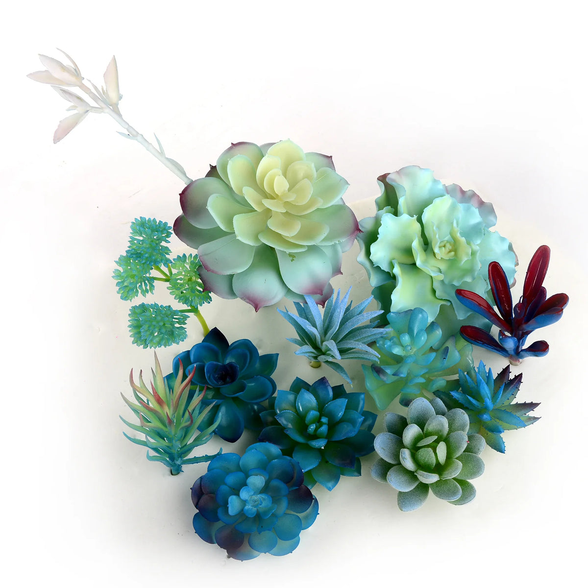 A cluster of blue and green artificial succulent plants with various textures and shades