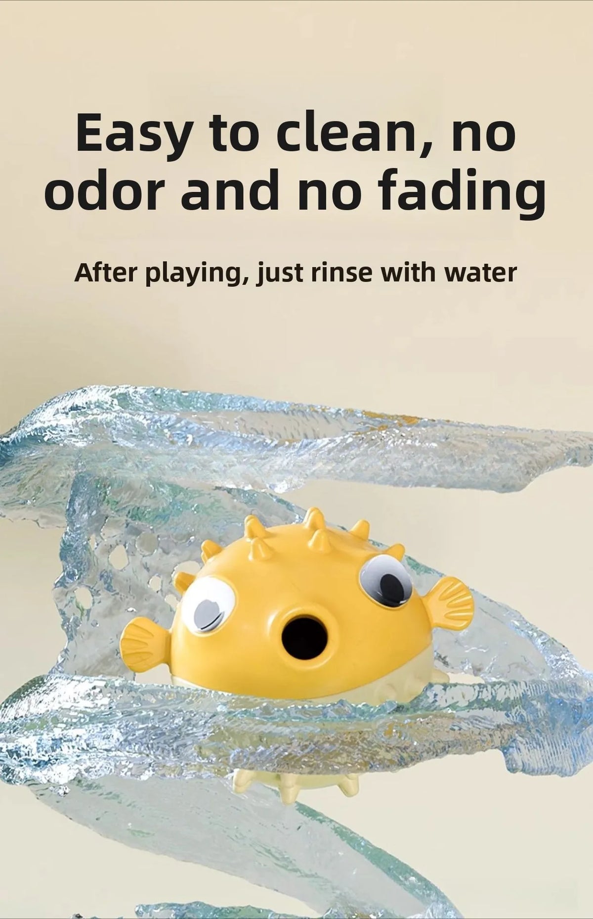 A yellow interactive bouncing fish treat dispenser for pets is shown being rinsed with water.