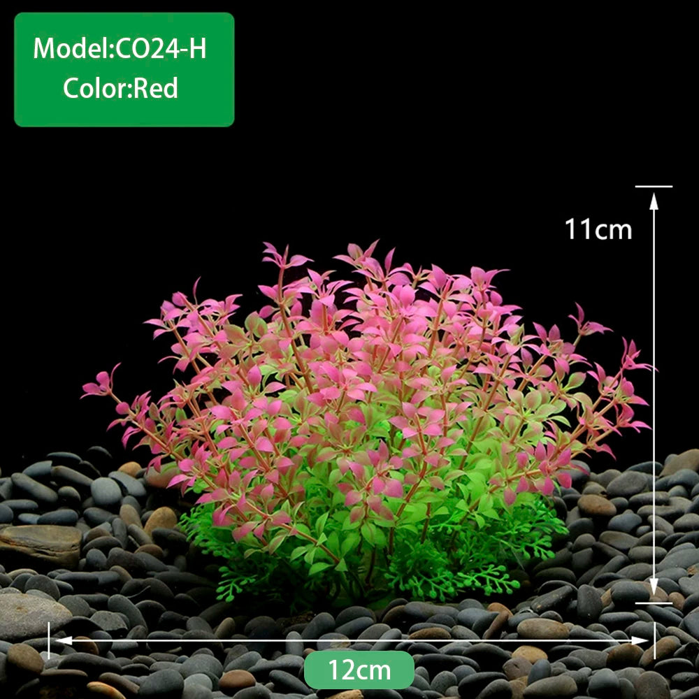 Une plante aquatique artificielle rouge vif avec du feuillage vert plantée dans du gravier foncé.