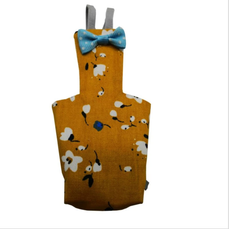 A yellow parrot-themed diaper featuring a blue bowtie and white and black bird patterns.