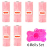 A set of six pink reusable pet poop bag dispensers with orange arrows and a pink leash clip.