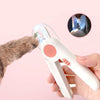 A hand holds an LED pet nail clipper, showing the device and a close-up of its light feature.