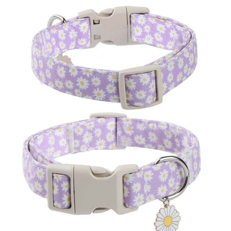 A light purple adjustable spring dog collar decorated with white flowers.