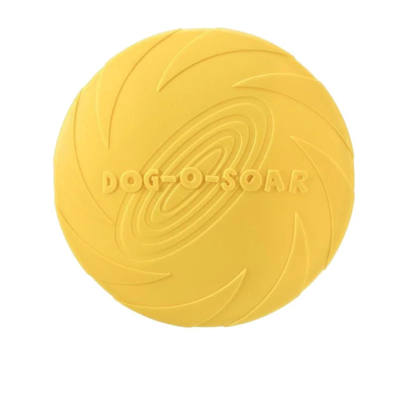 A bright yellow soft silicone flying disc for dogs with a textured surface.