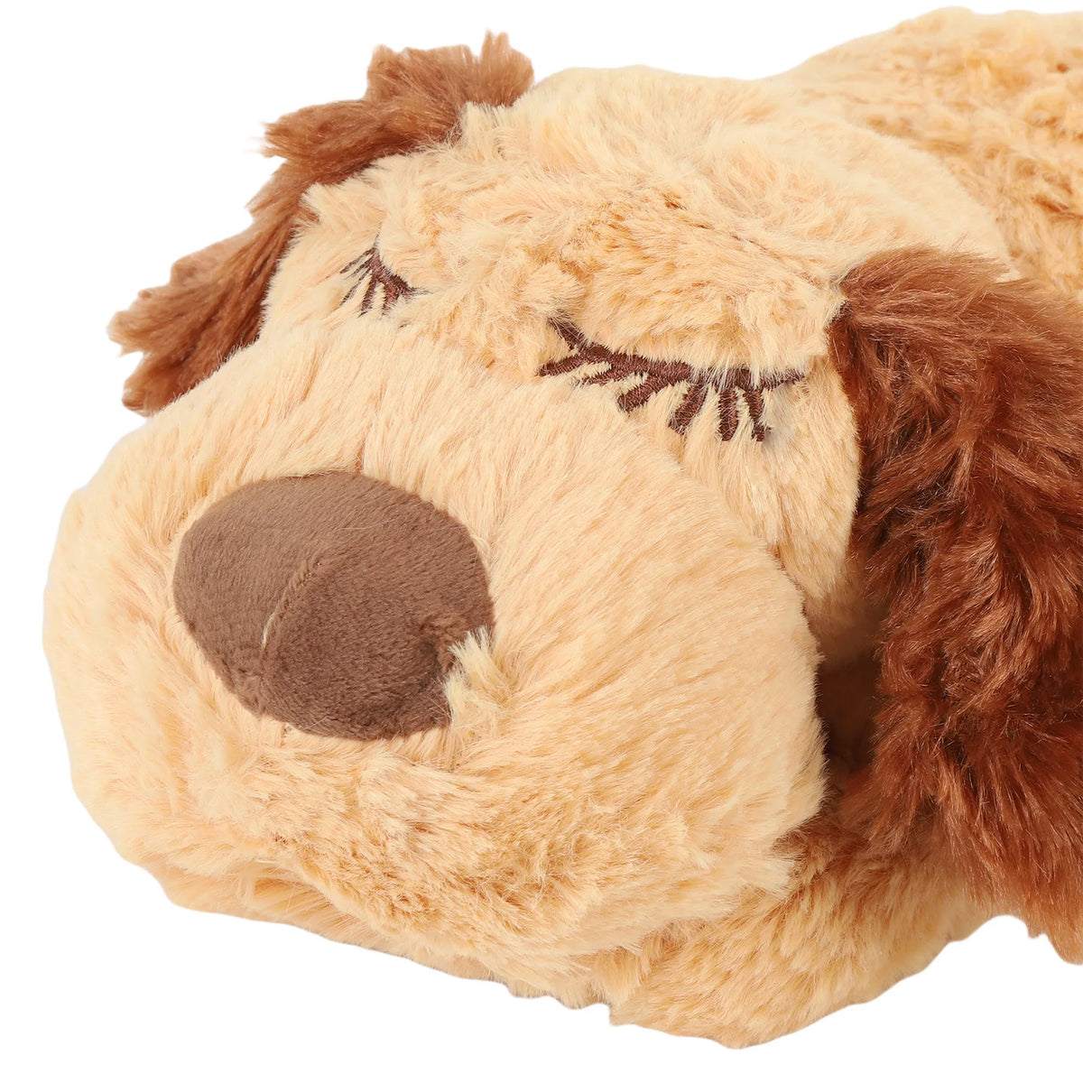 A light tan stuffed animal resembling a dog's head with brown floppy ears and eyes.