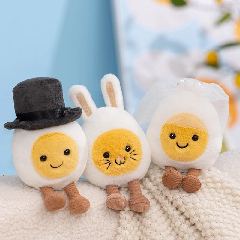 Three adorable dessert plush toys shaped like eggs with rabbit ears and yellow faces