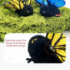A black butterfly cat toy with yellow wings is shown opening its wings to increase movement range.