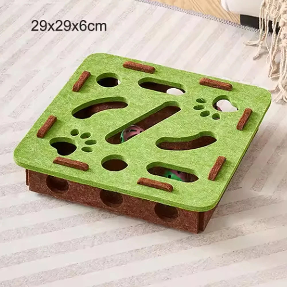 A green sisal cat scratching post with holes and wooden blocks for interactive play.