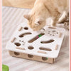 A cat is playing with an interactive felt puzzle toy designed for playtime.