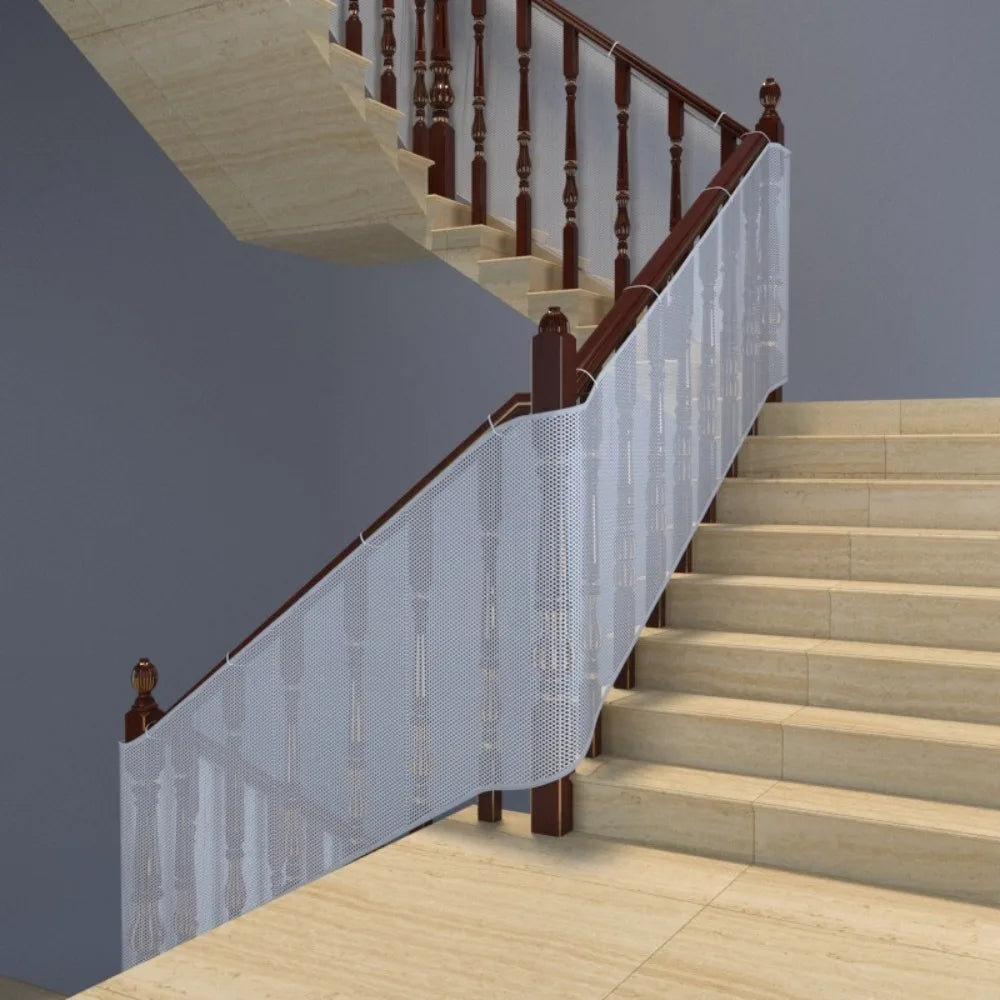 A wooden staircase with a safety mesh barrier installed along the railing.