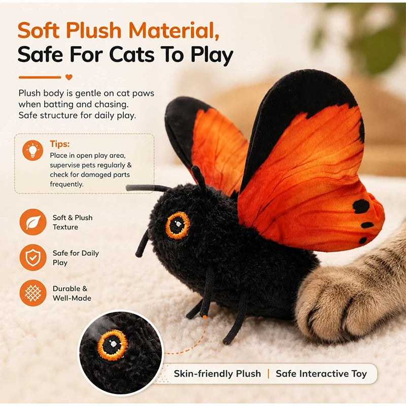 A black and orange butterfly-shaped plush toy for cats, shown next to a cat paw.