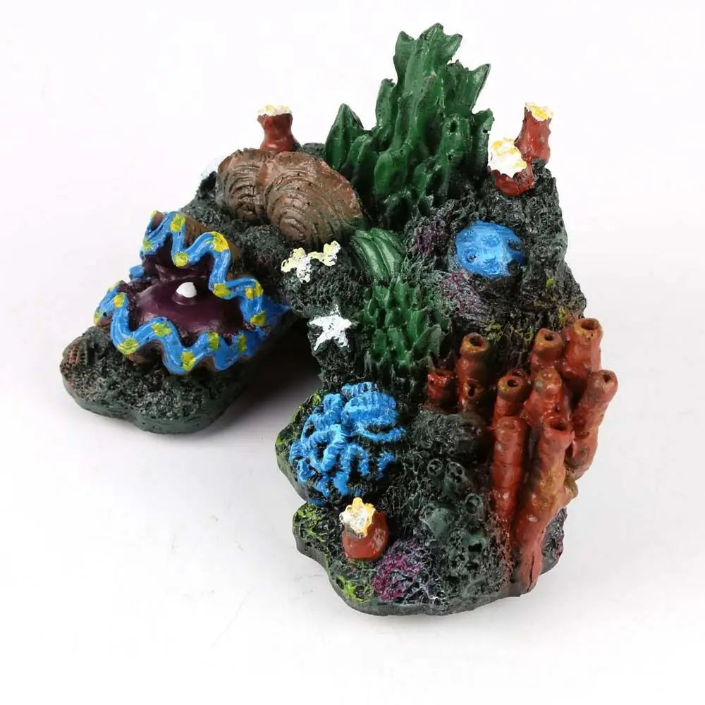 A miniature simulated coral reef island ornament featuring various textured green, purple, and orange elements.