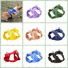 A collection of various colored reflective dog harnesses and vests for dogs.