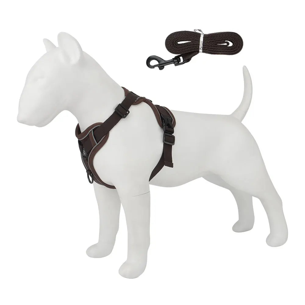 A white dog harness and leash set with a dark brown leather strap is displayed against a white background.