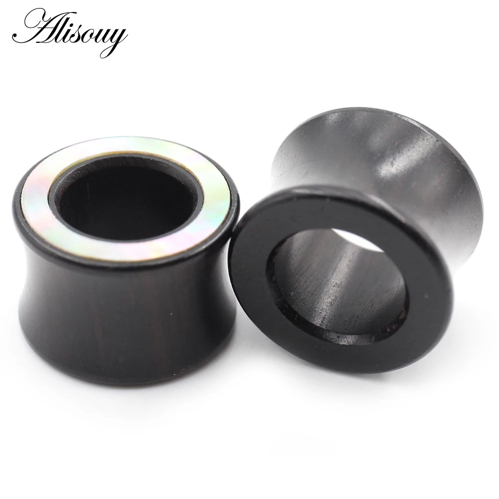 A pair of black wood ear tunnels with a shiny inlay are shown against a white background.
