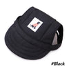 Black pet grooming visor cap featuring a silhouette of a dog on a white patch